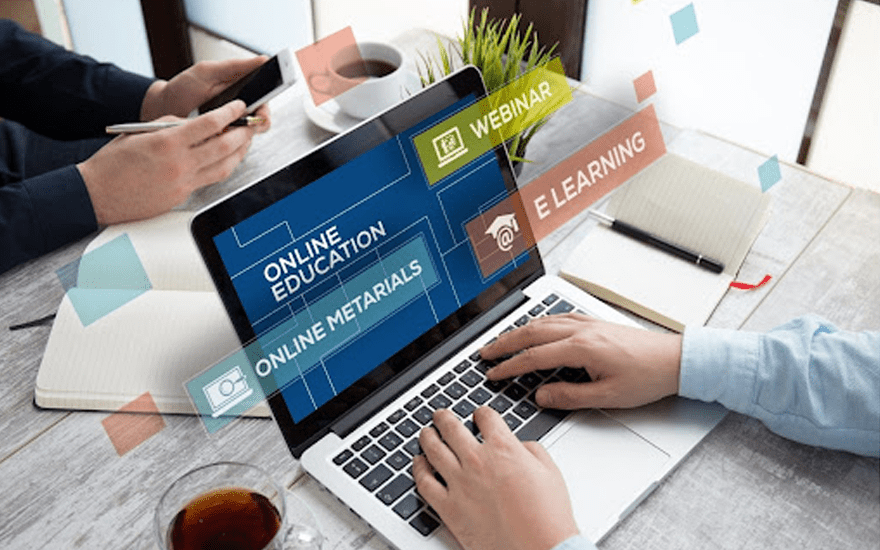 Man Typing on a Laptop With Various Graphics