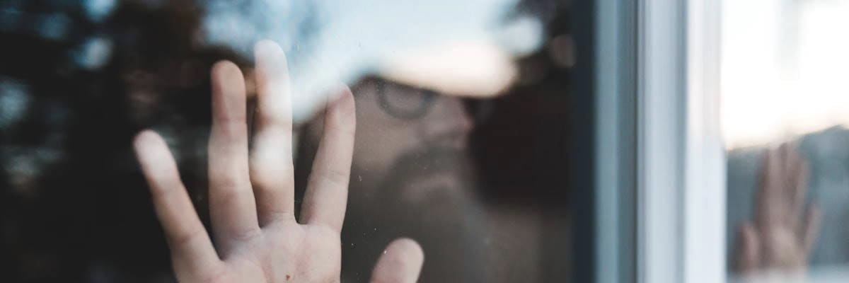 Man With His Hand on a Window