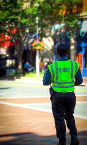 Security Guard Standing on side walk