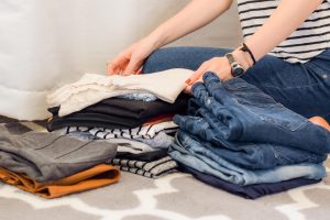 Laundress folding laundry
