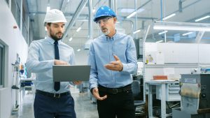 Facilities Managers pointing at computer and showing employee
