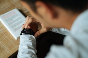 man unlocking his smart watch