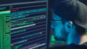 an it specialist looking at a computer screen