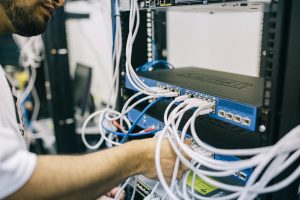 An IT worker fixing servers