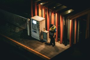 A security guard looking at his phone