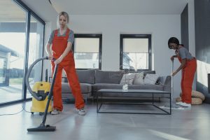 A couple of cleaners cleaning a luxury house