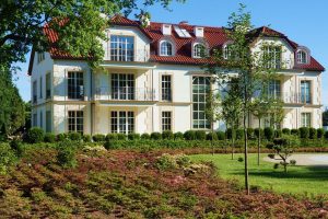 A white building that is a part of an estate